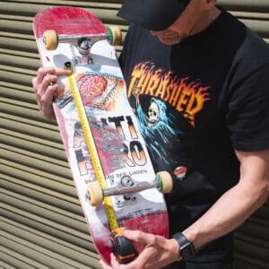 Nick measuring his skateboard