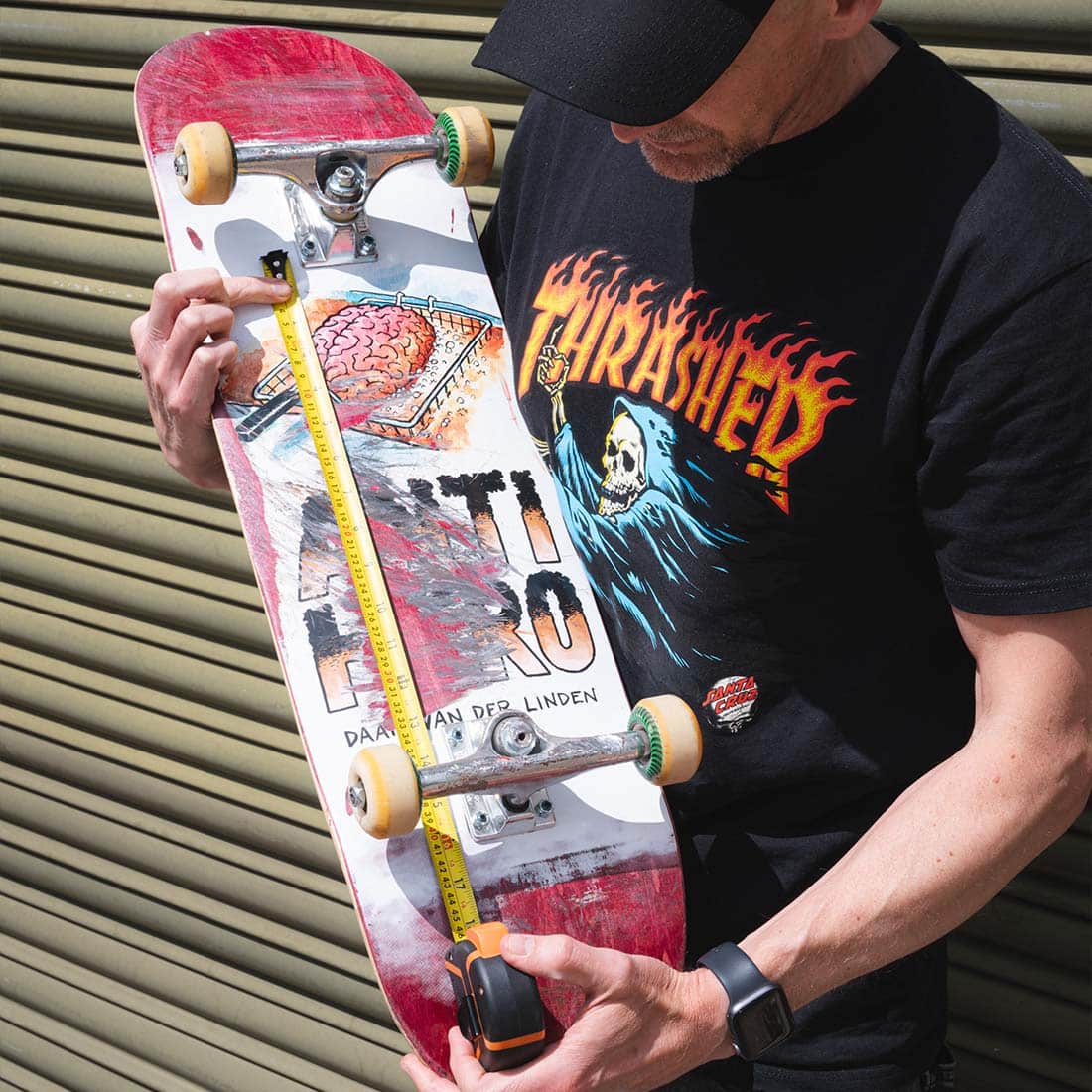 Nick measuring his skateboard